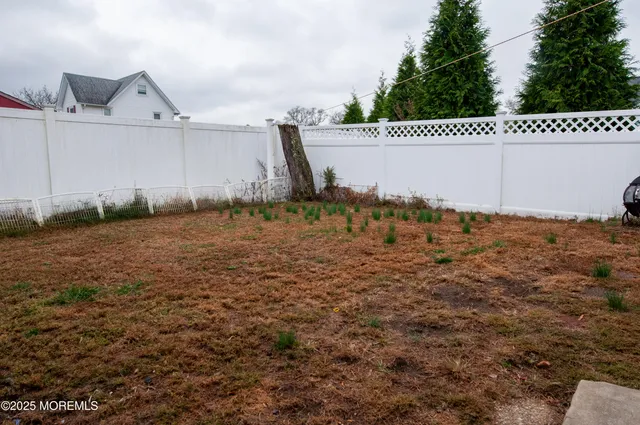 a view of a house with large windows
