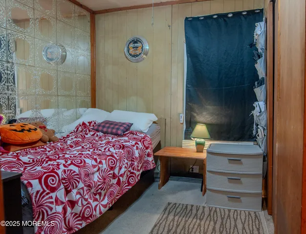 a bedroom with two beds and a window