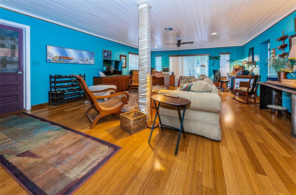 330 North Spring Boulevard Tarpon Springs, FL 34689 - Photo 15 of 34 a living room with furniture and a wooden floor