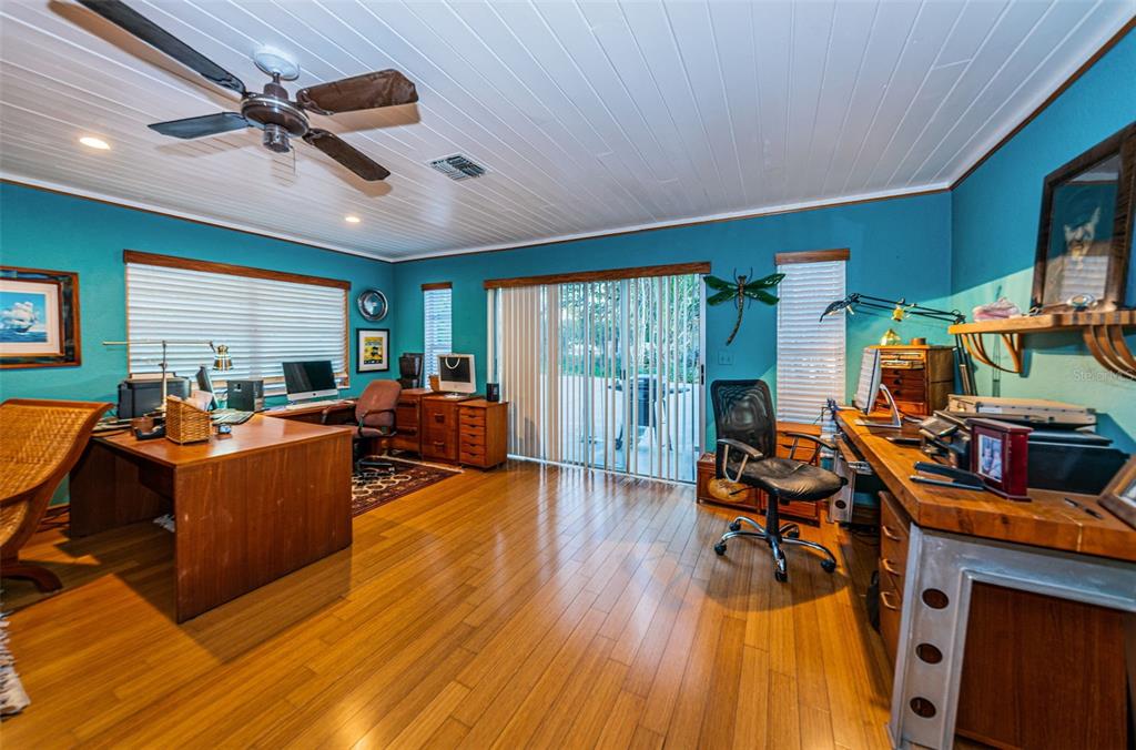 330 North Spring Boulevard Tarpon Springs, FL 34689 - Photo 17 of 34 a living room with furniture and a wooden floor