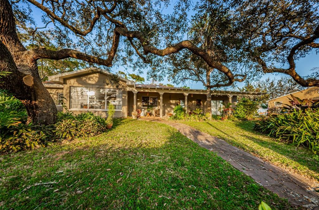 330 North Spring Boulevard Tarpon Springs, FL 34689 - Photo 2 of 34 a view of house with a swimming pool
