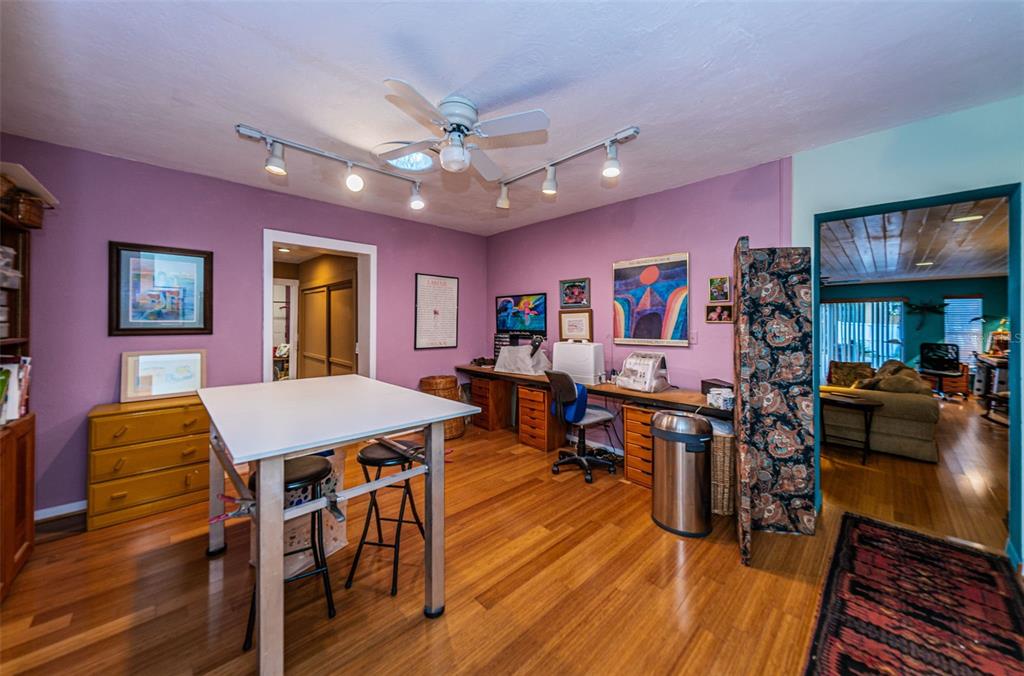 330 North Spring Boulevard Tarpon Springs, FL 34689 - Photo 27 of 34 a view of a dining room with furniture a chandelier and wooden floor