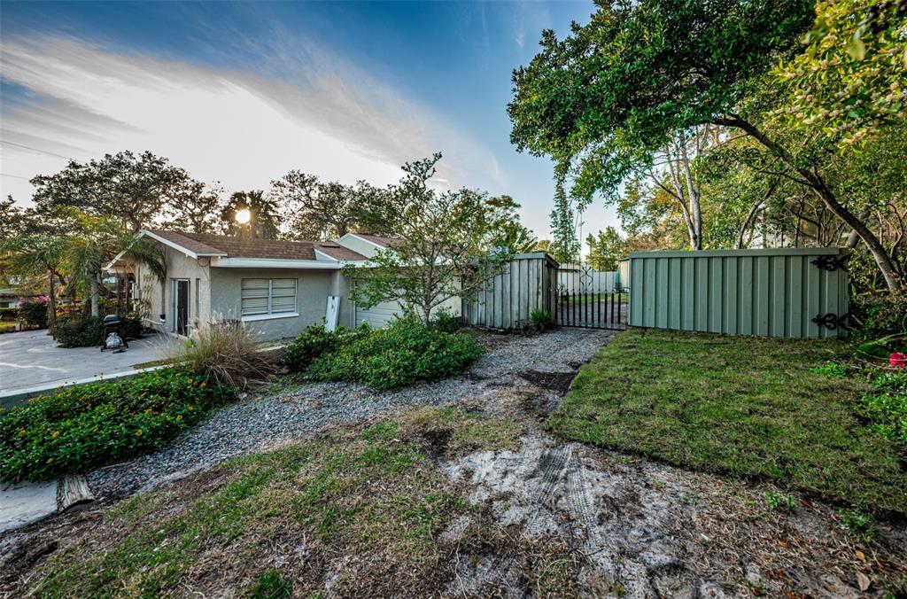 330 North Spring Boulevard Tarpon Springs, FL 34689 - Photo 30 of 34 a view of a house with a garden