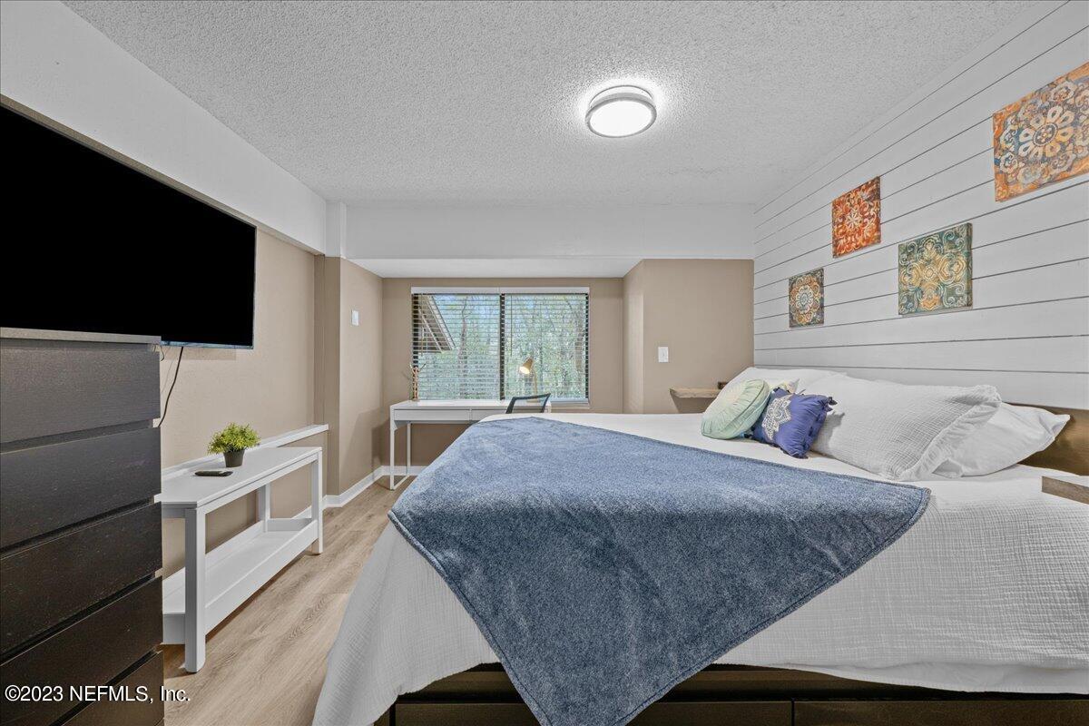 3155 Ravines Road, Unit 3522 Middleburg, FL 32068 - Photo 11 of 20 a bedroom with a bed and a flat screen tv