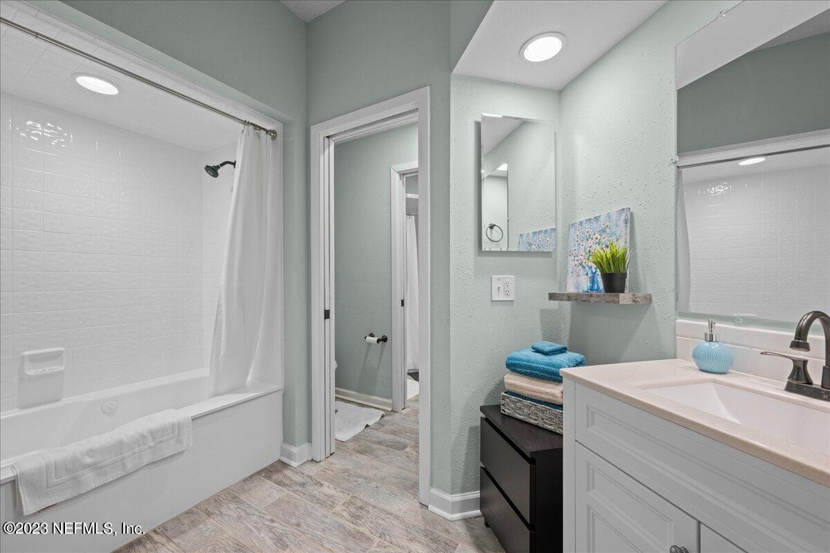 3155 Ravines Road, Unit 3522 Middleburg, FL 32068 - Photo 13 of 20 a bathroom with a sink a toilet and shower