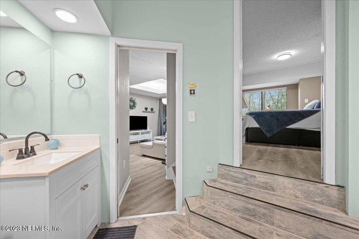 3155 Ravines Road, Unit 3522 Middleburg, FL 32068 - Photo 14 of 20 a en suite bathroom with a sink and a mirror