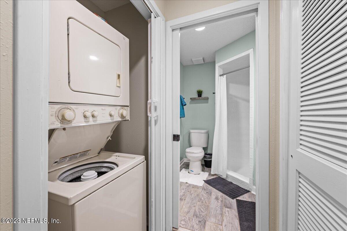 3155 Ravines Road, Unit 3522 Middleburg, FL 32068 - Photo 17 of 20 a bathroom with a toilet a sink and glass door
