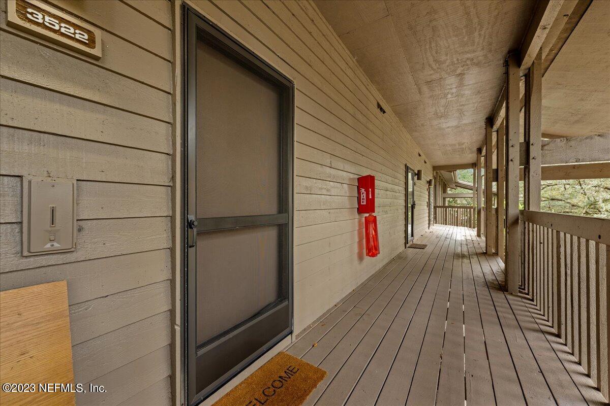 3155 Ravines Road, Unit 3522 Middleburg, FL 32068 - Photo 20 of 20 a view of a balcony with wooden floor