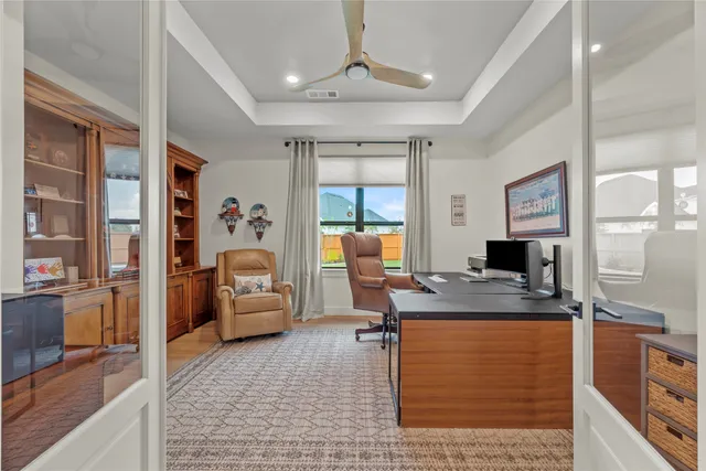 a large bedroom with a large bed and a large window