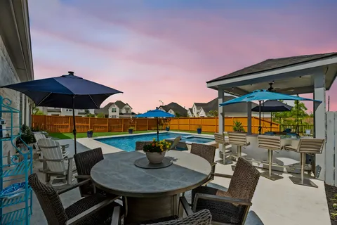 an aerial view of residential house with swimming pool