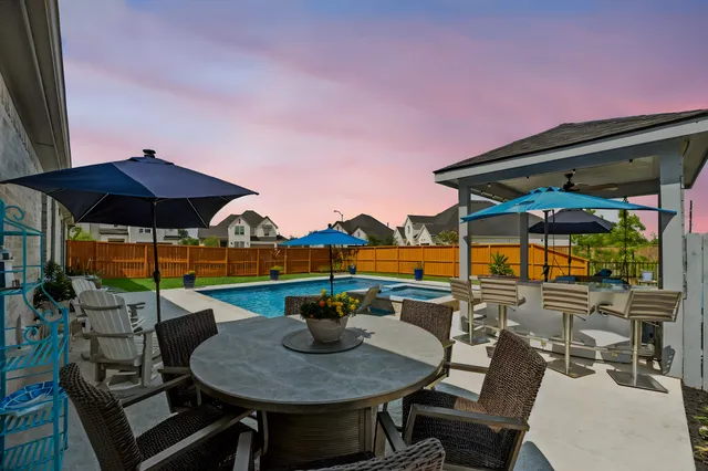 an aerial view of residential house with swimming pool