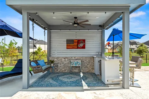 a view of a house with a yard and sitting area
