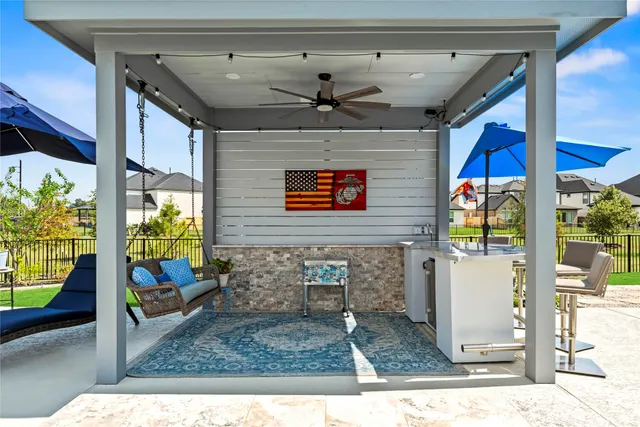 a view of a house with a yard and sitting area