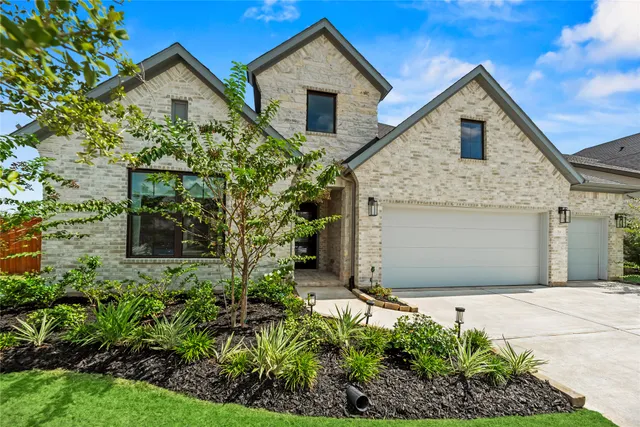 a view of a hallway with wooden floor and windows