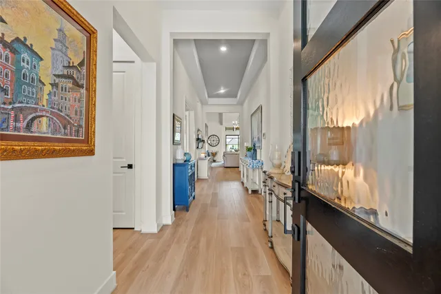 a living room with furniture a chandelier and a chandelier