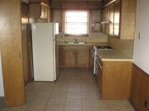 6111 38th Street, Unit A Lubbock, TX 79407 - Photo 3 of 9 a utility room with cabinets washer and dryer