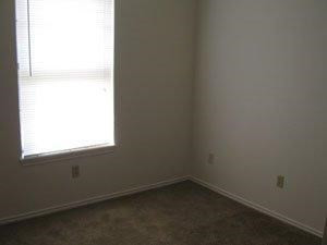 6111 38th Street, Unit A Lubbock, TX 79407 - Photo 9 of 9 an empty room with a window