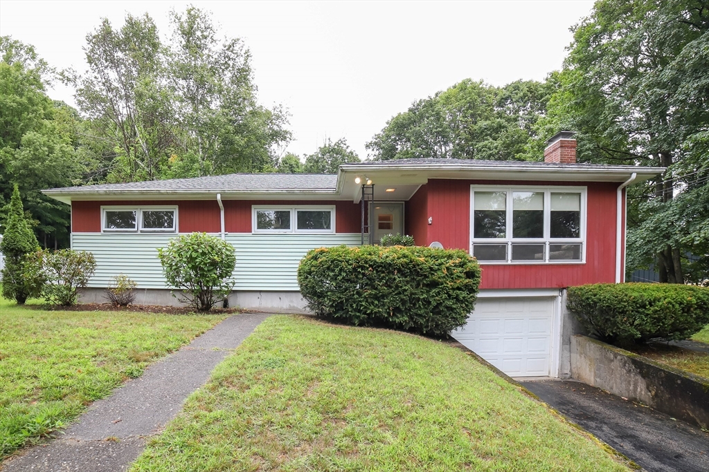 6 Reservoir Street Cherry Valley, MA 01611 - Photo 1 of 35 a front view of a house with garden