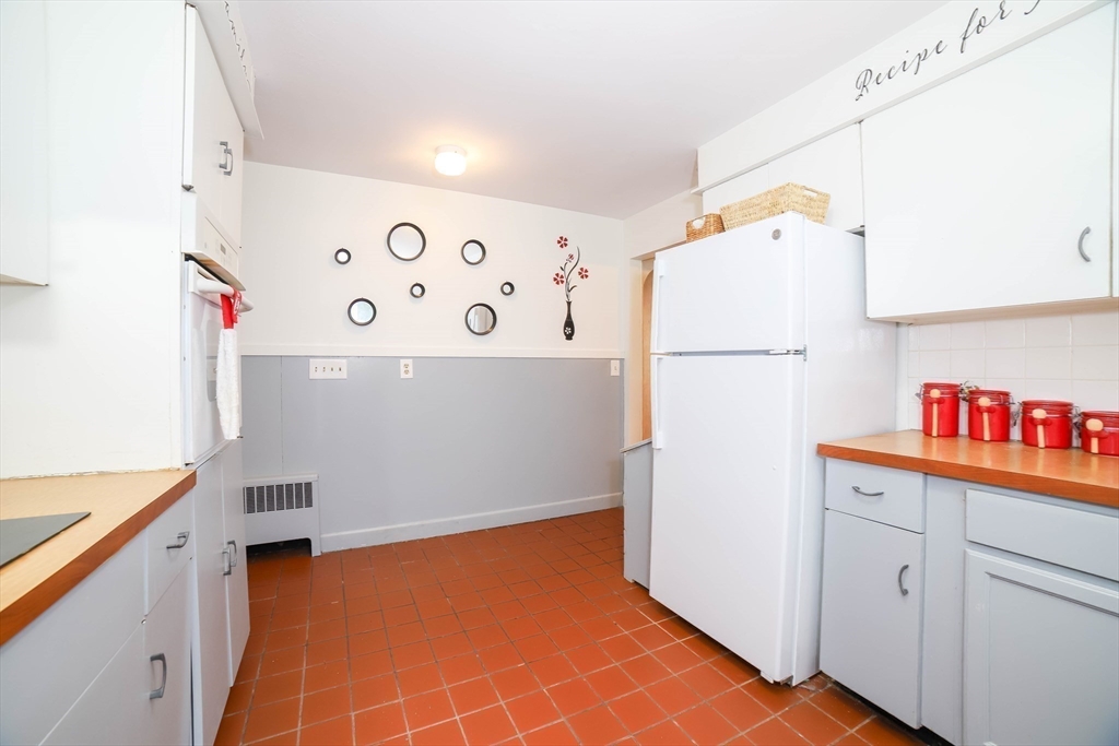 6 Reservoir Street Cherry Valley, MA 01611 - Photo 11 of 35 a white refrigerator freezer sitting inside of a kitchen