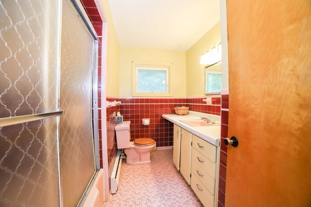 6 Reservoir Street Cherry Valley, MA 01611 - Photo 15 of 35 a bathroom with a sink a toilet and shower