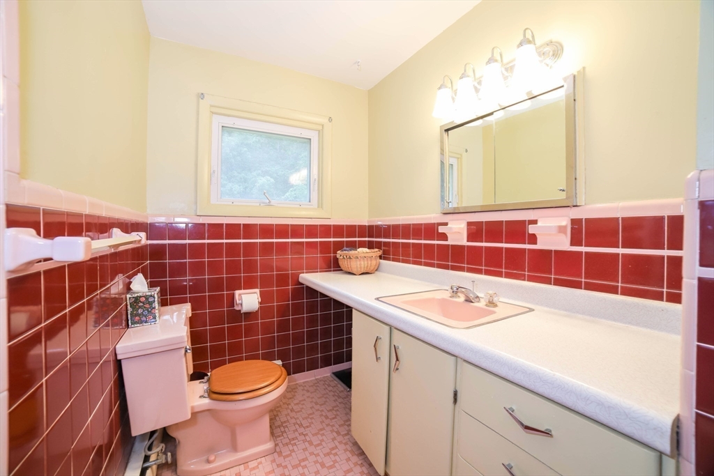 6 Reservoir Street Cherry Valley, MA 01611 - Photo 16 of 35 a bathroom with a sink a toilet and a mirror