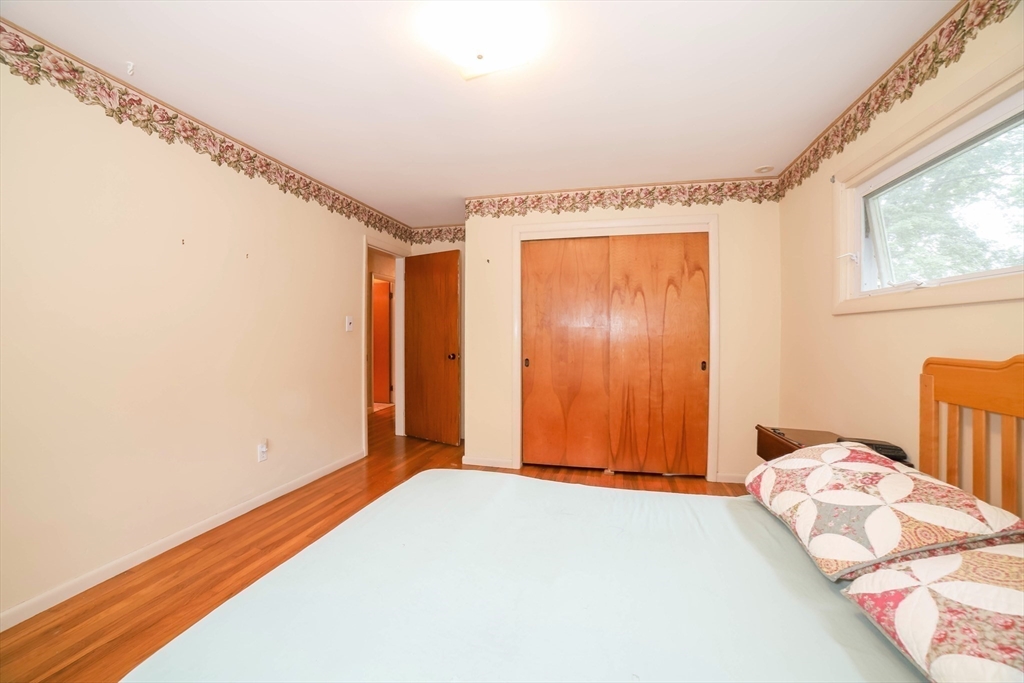 6 Reservoir Street Cherry Valley, MA 01611 - Photo 17 of 35 a bedroom with a bed and a window