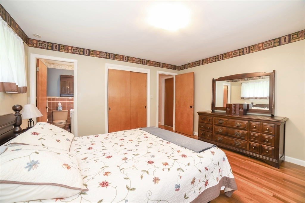 6 Reservoir Street Cherry Valley, MA 01611 - Photo 18 of 35 a bedroom with a bed and a dresser