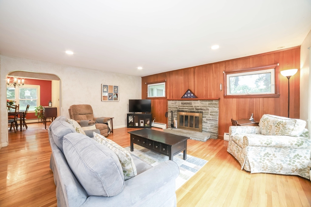 6 Reservoir Street Cherry Valley, MA 01611 - Photo 2 of 35 a living room with furniture and a fireplace