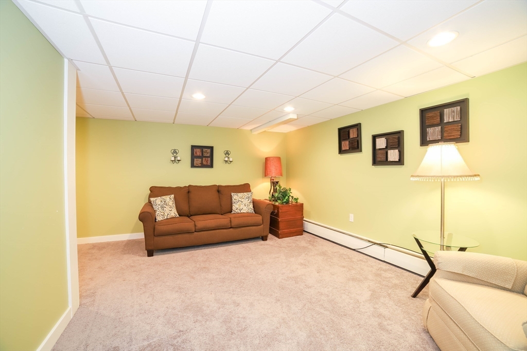 6 Reservoir Street Cherry Valley, MA 01611 - Photo 23 of 35 a living room with furniture and a table