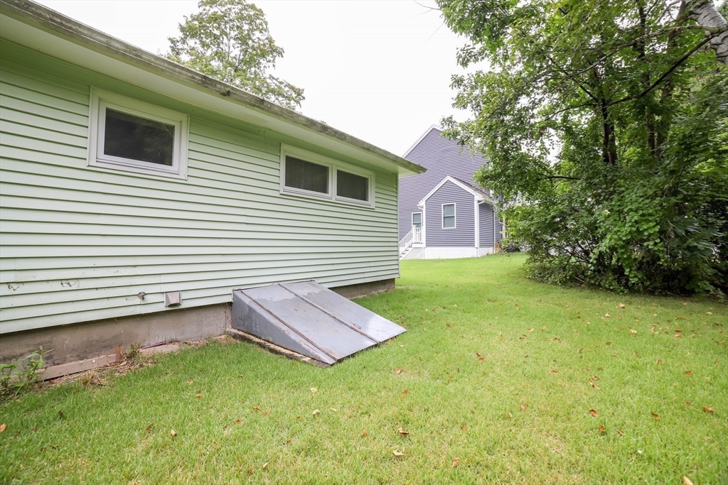 6 Reservoir Street Cherry Valley, MA 01611 - Photo 30 of 35 a backyard of a house with table and chairs