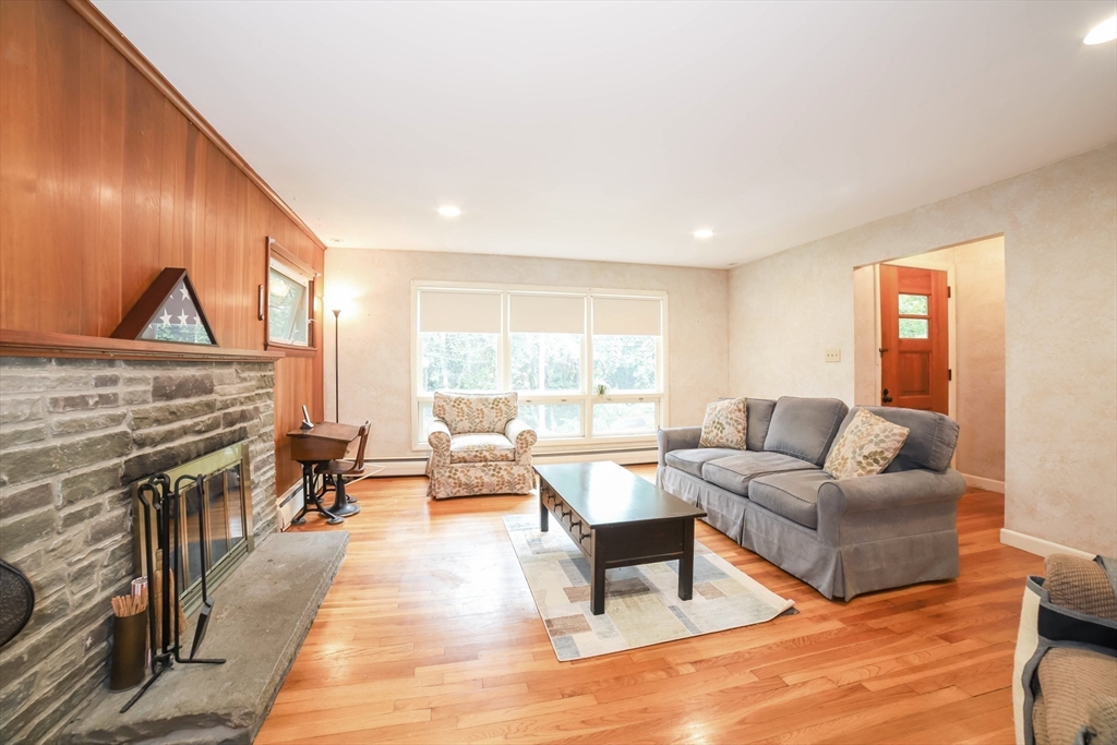 6 Reservoir Street Cherry Valley, MA 01611 - Photo 3 of 35 a living room with furniture and a fireplace