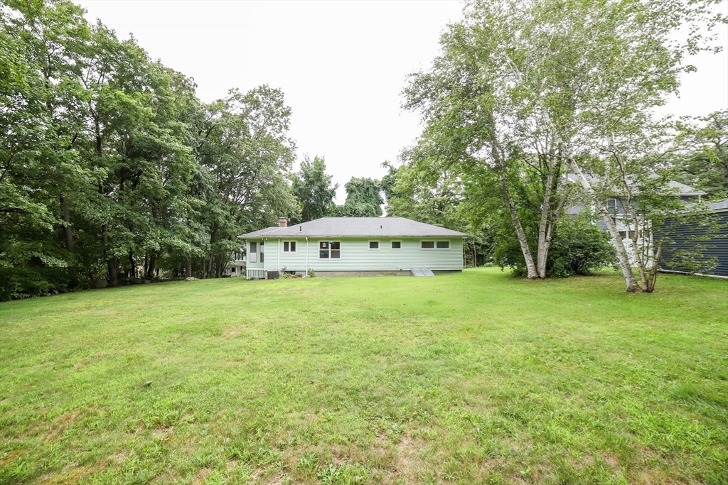 6 Reservoir Street Cherry Valley, MA 01611 - Photo 31 of 35 a view of a big house with a big yard and large trees
