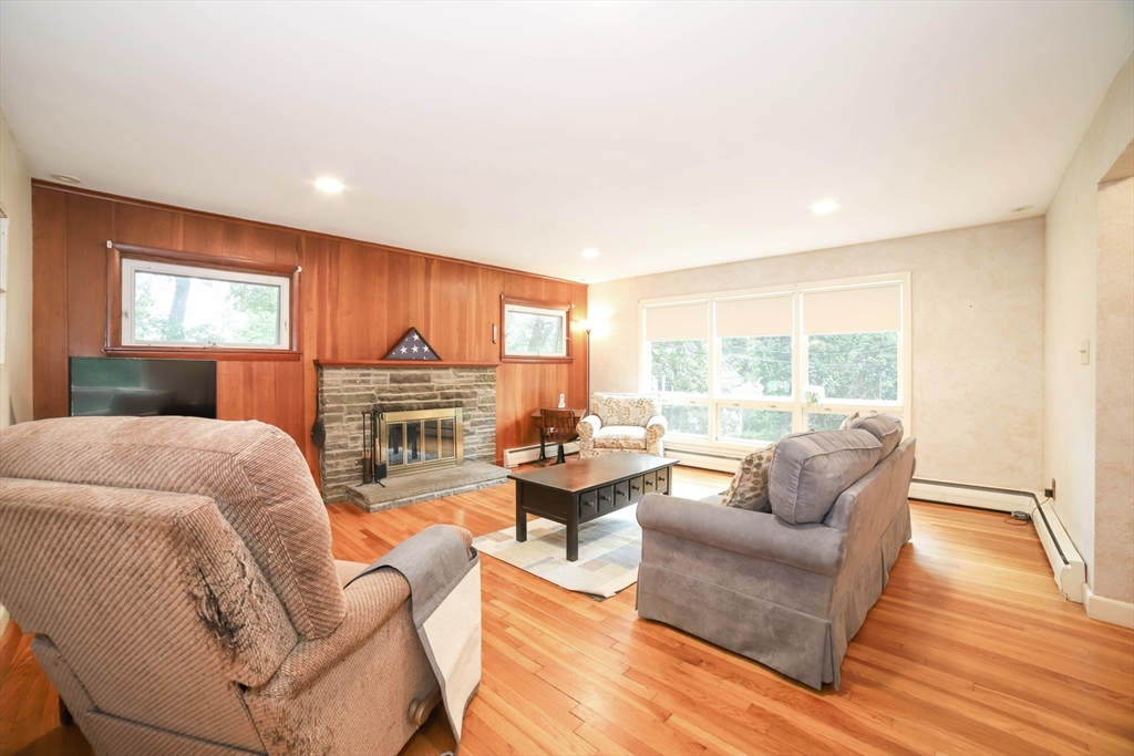 6 Reservoir Street Cherry Valley, MA 01611 - Photo 4 of 35 a living room with furniture and a large window