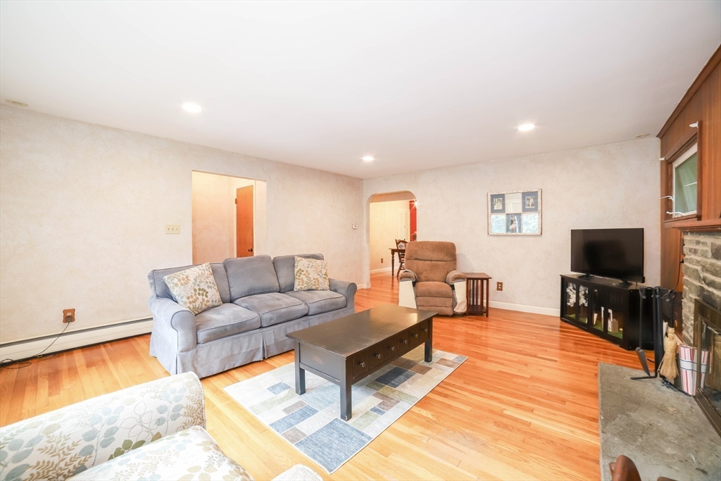 6 Reservoir Street Cherry Valley, MA 01611 - Photo 5 of 35 a living room with furniture and a flat screen tv