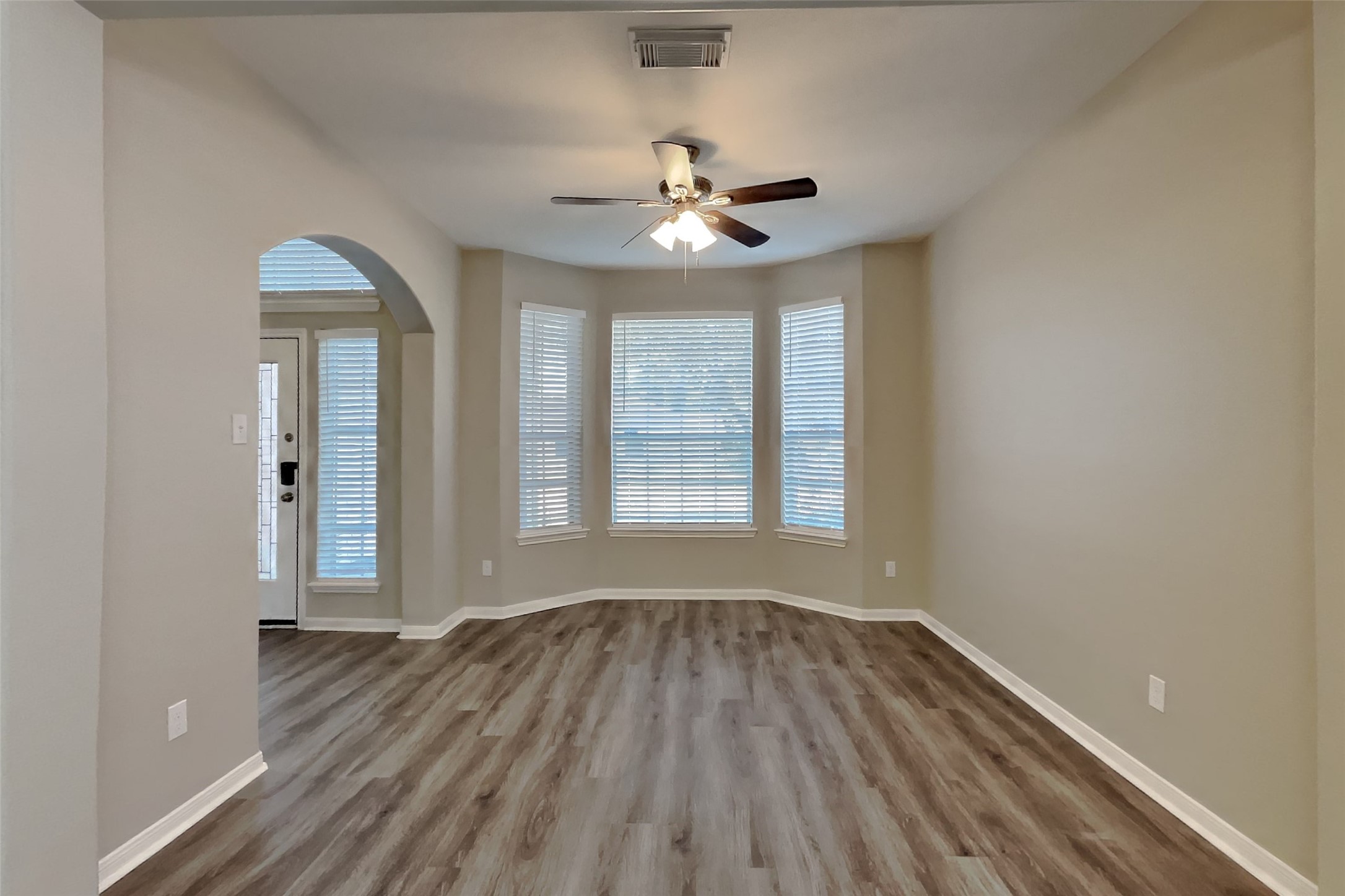 21122 Covington Bridge Lane Spring, TX 77388 - Photo 2 of 26 wooden floor in an empty room with a window