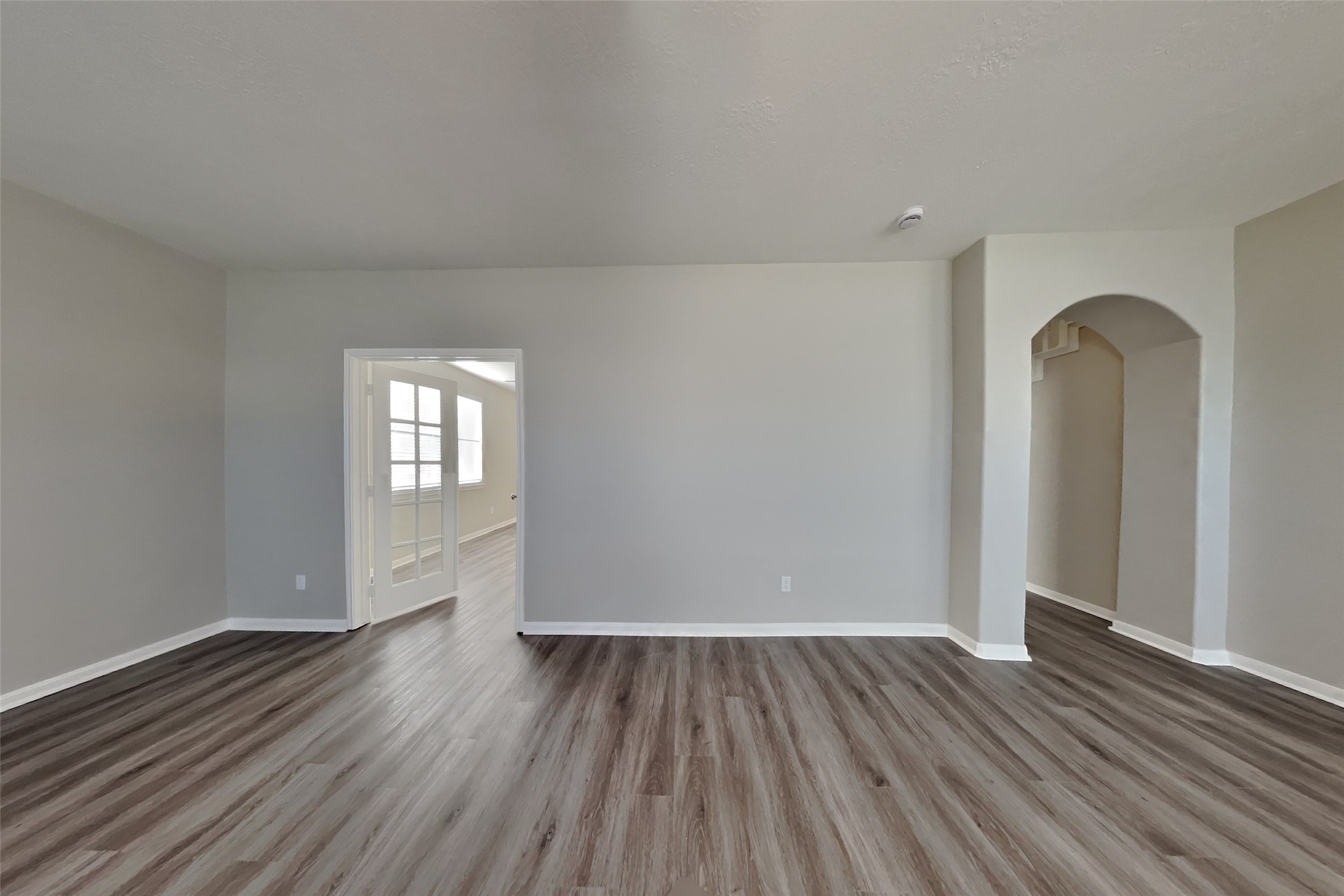 21122 Covington Bridge Lane Spring, TX 77388 - Photo 4 of 26 an empty room with wooden floor and windows