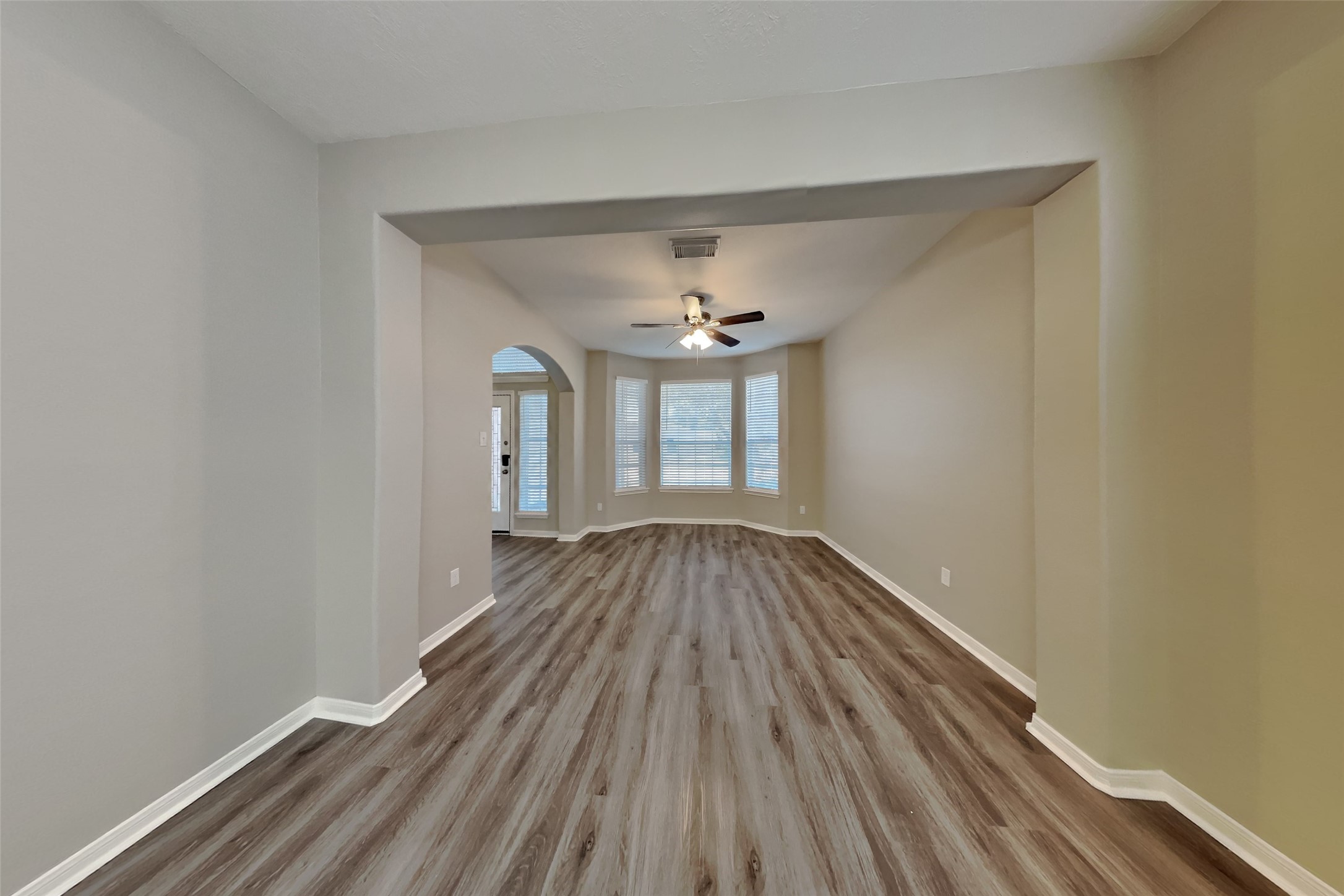 21122 Covington Bridge Lane Spring, TX 77388 - Photo 8 of 26 wooden floor in an empty room with a window
