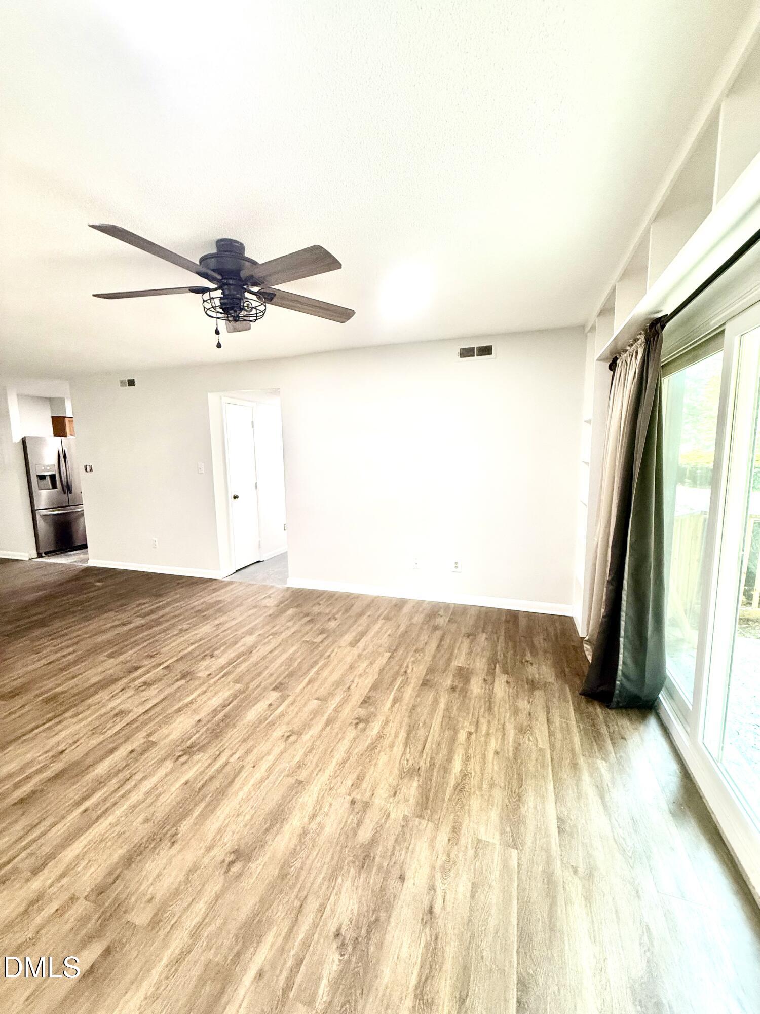 546 Pine Ridge Place Raleigh, NC 27609 - Photo 3 of 28 a view of a room with wooden floor