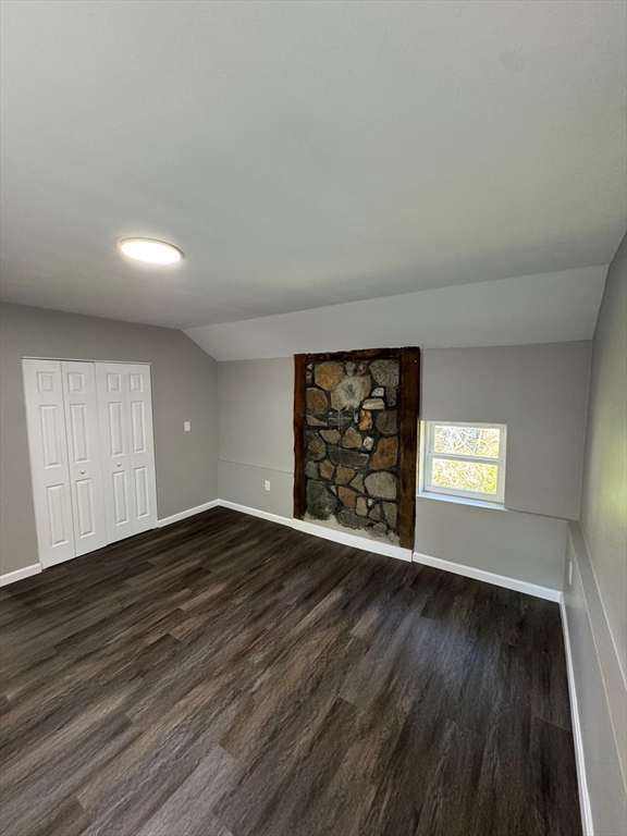 32 Main Street Monson, MA 01057 - Photo 20 of 42 an empty room with wooden floor and window