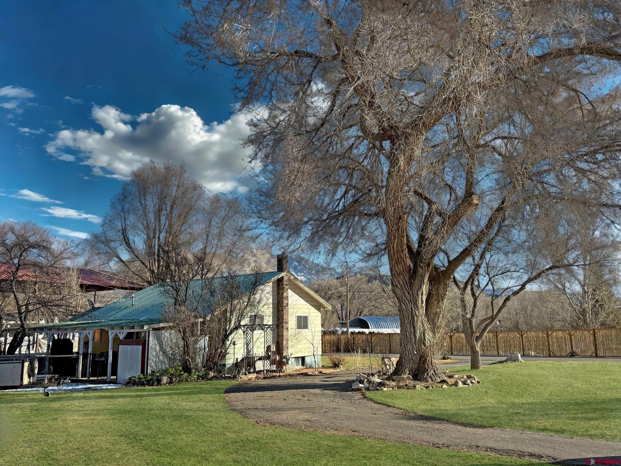 458 Price Road Paonia, CO 81428 - Photo 3 of 44 a view of a house with a yard