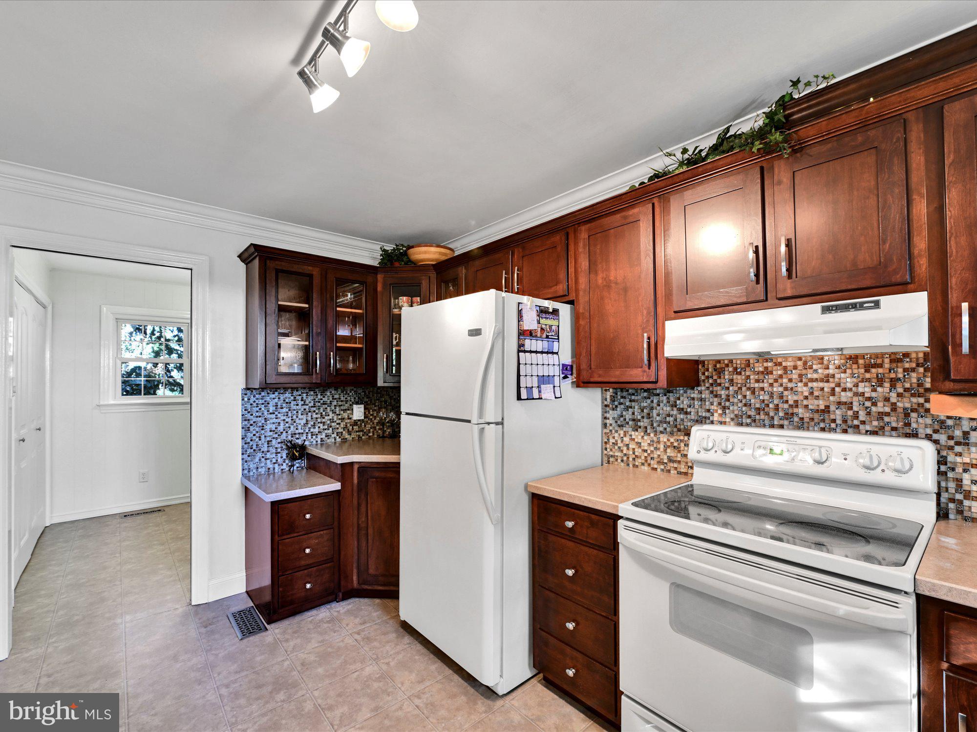 1701 South Colebrook Road Lancaster, PA 17601 - Photo 22 of 43 a kitchen with refrigerator and cabinets