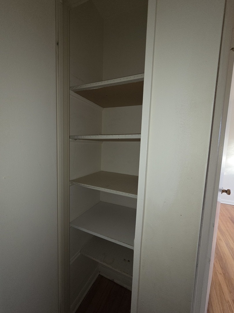 8649 Niles Center Road, Unit B Skokie, IL 60077 - Photo 15 of 22 a view of walk in closet with empty racks
