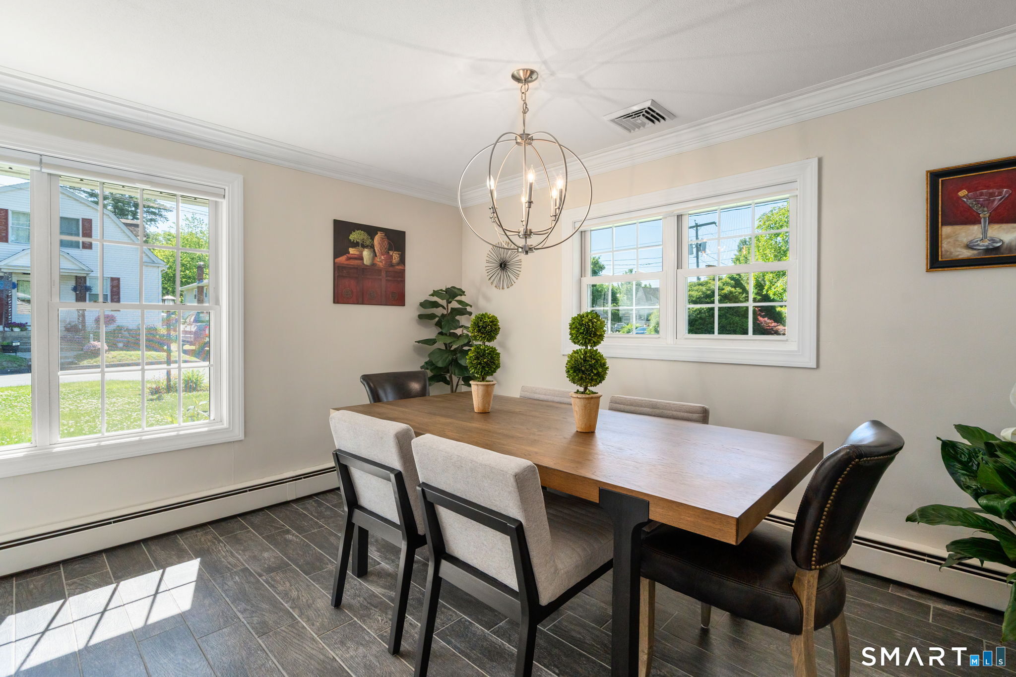 31 Cowan Street Suffield, CT 06078 - Photo 9 of 29 a view of a dining room with furniture window and wooden floor