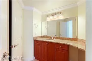 a bathroom with a granite countertop shower mirror and a sink