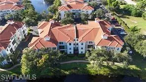 a view of a swimming pool with big trees
