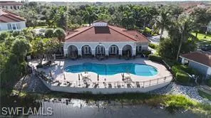 a view of swimming pool and outdoor seating