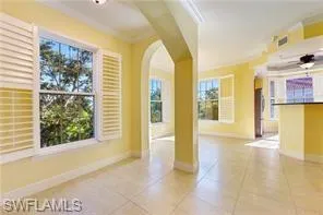 a view of an entryway with wooden floor and a window