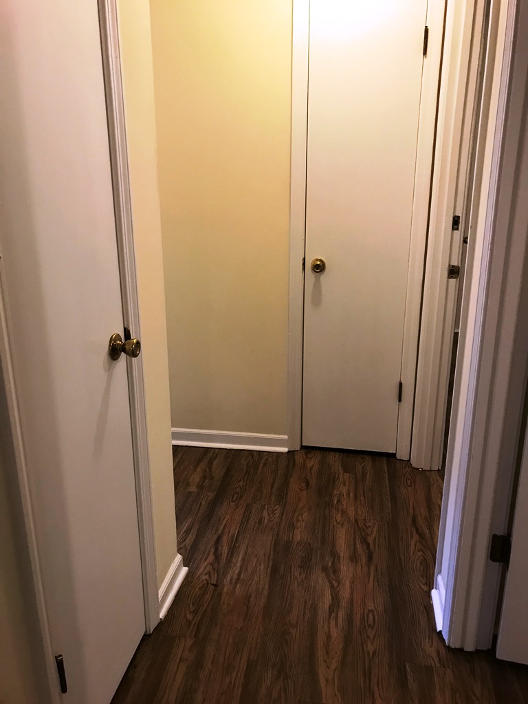 406 Old Central Road, Unit 1 Clemson, SC 29631 - Photo 6 of 8 This hallway features rich wood flooring, connecting various rooms with a clean aesthetic.
