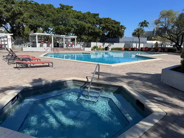 a view of a yard with cars