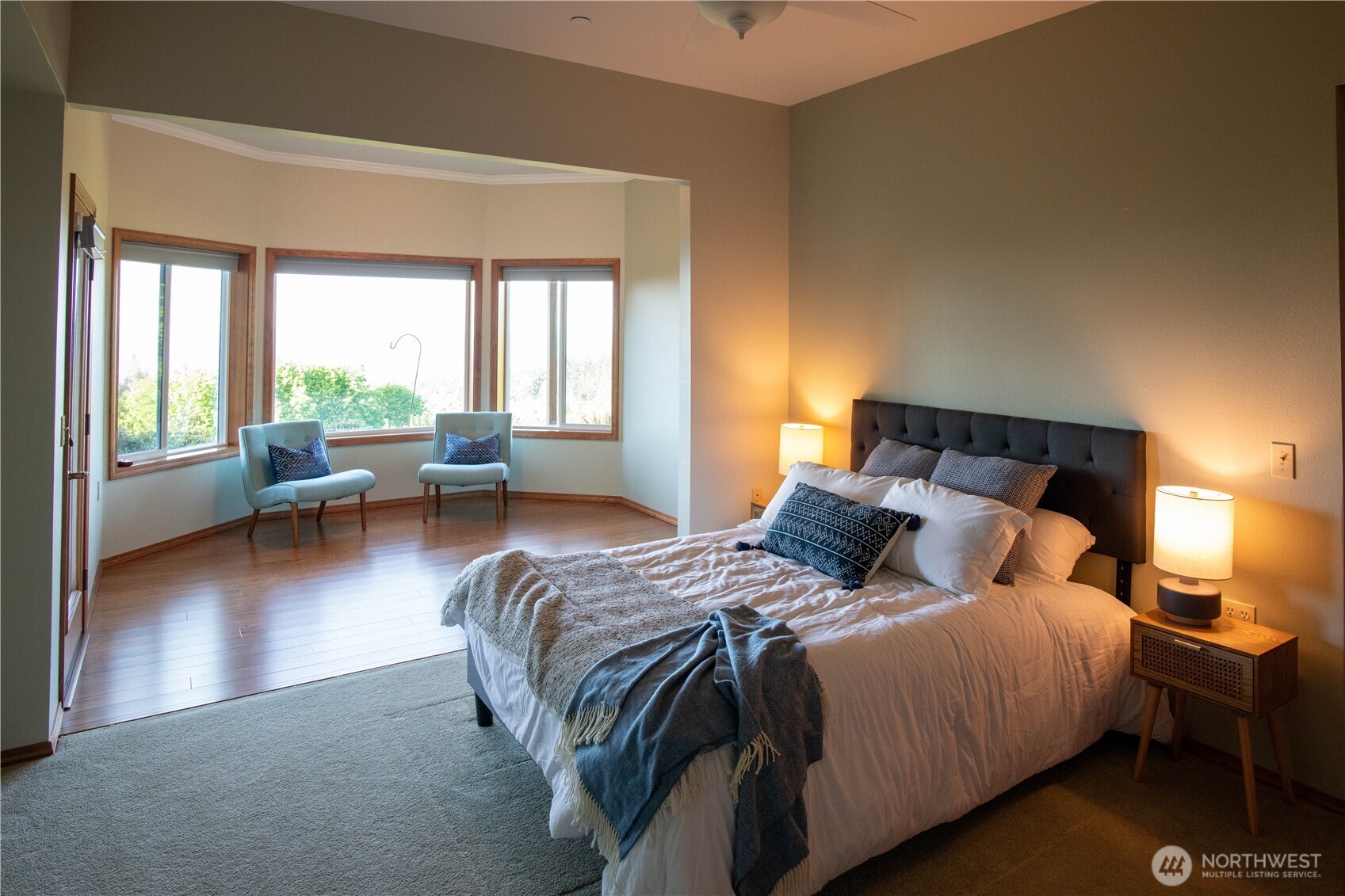 975 Simmons Road Port Angeles, WA 98362 - Photo 28 of 40 a bedroom with a bed and wooden floor